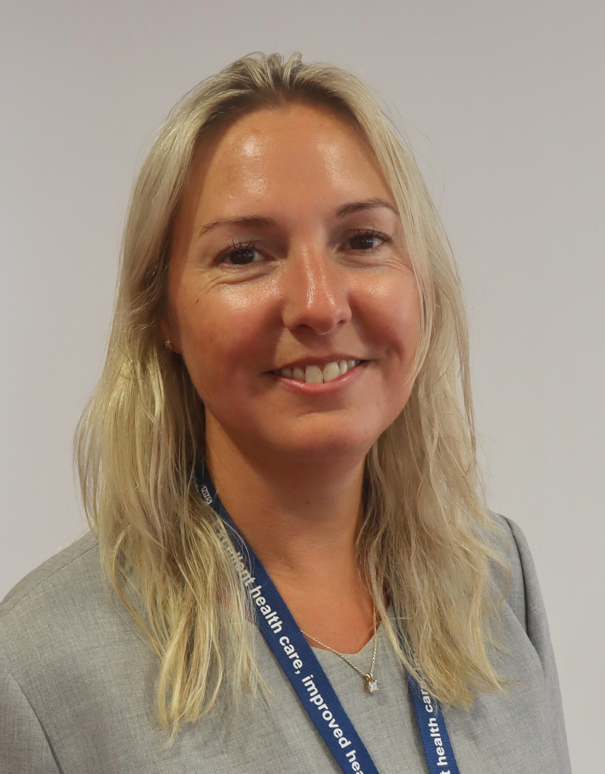 Headshot of Jo Hanley, smiling at the camera