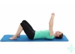 Woman lying on her back with her arms in the air
