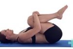 Knee Hugs
Lie on your back and gently bring one knee toward your chest and then the other. Use your arms to hug your knees in as close as you can manage comfortably. Hold for ten seconds if able.